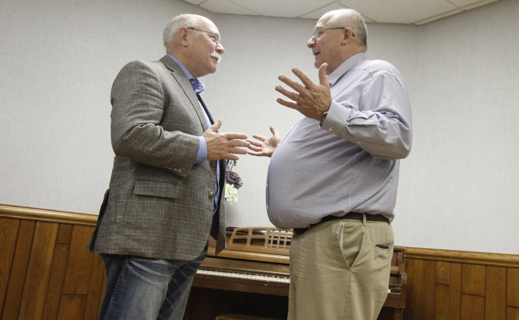 Dist. 34 Sen. Curt Friesen converses with Aurora City Administrator Rick Melcher after his town hall speech at the Bremer Community Center Friday. Friesen is nearing the end of his final session, since he is being term-limited out at the end of the year.