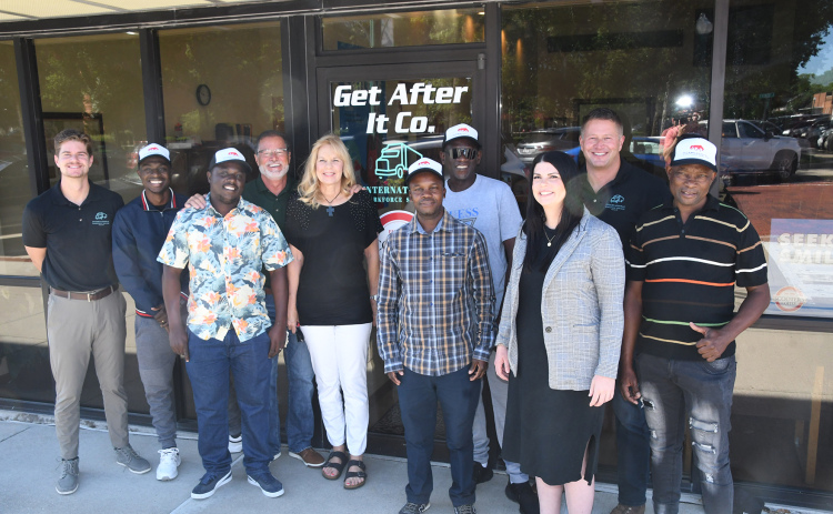 Staff and clients representing International Workforce Services in Aurora include, from left:  Trevor Vettel, Sebastian Moyo, Toddy Mukuya, David Vettel, Crystal Vettel, History Matyabadza, Emmanuel Manyewv, Celie Holliday, Todd Vettel, Felix Chipungu.