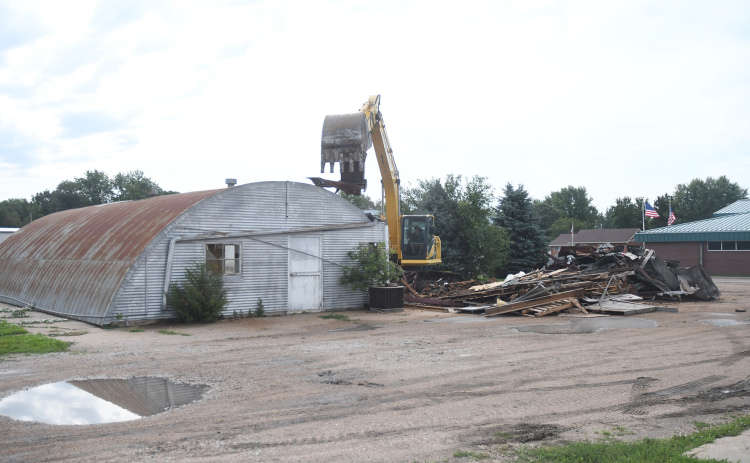 A building that has housed numerous businesses since its construction in 1956 came crashing down in July, one of many developments highlighted during an annual report of Aurora Development Corporation activities to the Aurora City Council.
