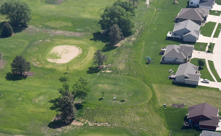 This aerial photo shows the impact of drought conditions at Poco Creek Golf Course, where a renovation project began this week to repair the greens.