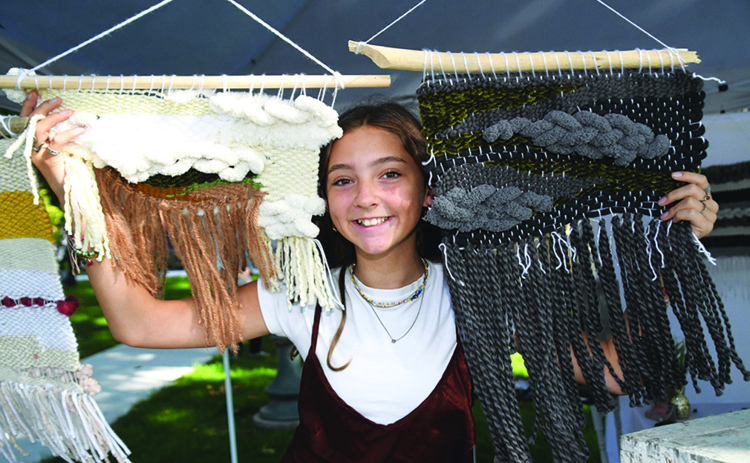 Annaston John was the youngest participant in last year’s Aurora Art Walk. At the age of 12, the Hampton middle school student displayed her weaving talents.