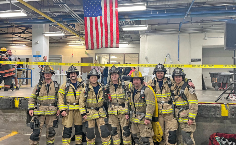Aurora Volunteer Fire and Rescue members Tanner Greenough (third from right) and Chris Hyde (far right) were among 343 firefighters who participated in the 9/11 Memorial Stair Climb. They participated in a team with Grand Island Fire.