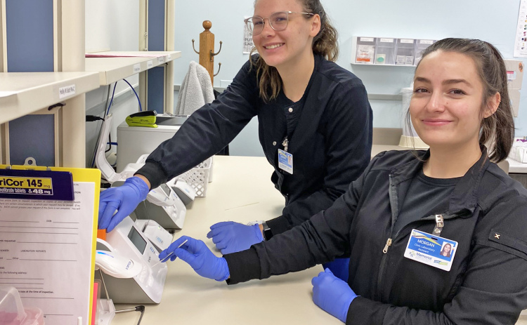 With the CDC community transmission level currently showing as yellow, MCHI’s staff, including clinic lab staff Arianna Harvey (left) and Morgan Sutter, are not required to wear a mask within the facility unless certain circumstances exist or while performing any tests that may normally require them to wear a mask.