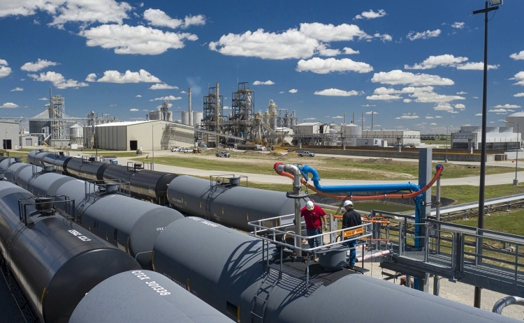 Crews work to fill rail cars with ethanol at the Aurora West facility on the edge of town. A new partnership was announced this week with a goal of increasing productivity and efficiency.
