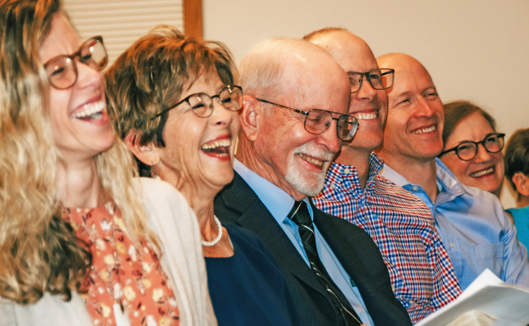 Kathy and Paul Nauman laugh at memories with the congregation at the 45 year celebration of their service at Stockham Community Church. Starting with a size of around 30, the Naumans have grown the church membership to about 300 through their decades of service.