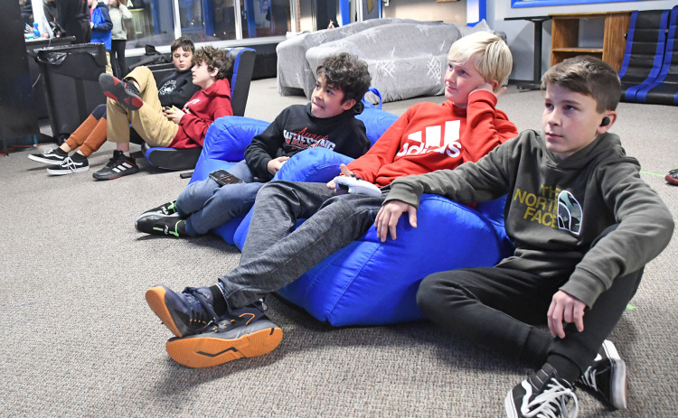 Three boys, Christian Jividan, Milo Gustafson and Ryder Retzlaff play an Xbox video game at the Hamilton County Youth Center. Paul Johnson claimed $40,000 in renovation to modernize the Youth Center with $50,000 raised for those costs and continued operations since reopening in June.