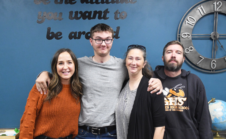 Gathered together, from left, special education teacher Kirsten Kreutz, Jacob, Becky and Kevin Wiles reflected on the Wiles’ journey since Jacob’s accident. More than a year after the accident, they shared the story of Jacob’s journey of reclaiming skills having sustained a traumatic brain injury.