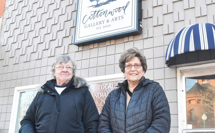 Village Square members, from left, Dorothy Balaban and Loretta Jost stand in front of the former location of Cottonwood Gallery. The retail cooperative will be moving from its location to the previous gallery space at the end of February. Moving members Joyce Dose, Becky Freelend and Janet Alberts are not pictured.