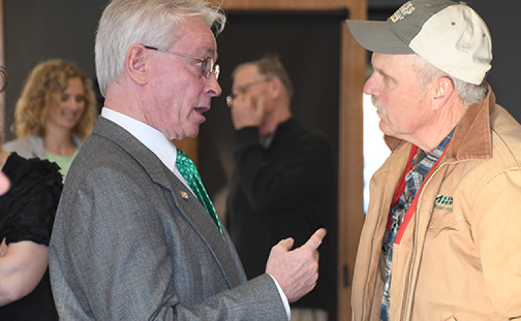 Dist. 34 Sen. Loren Lippincott, left, visits with Hamilton County Commissioner Francis McDonald after Friday’s legislative update in Aurora.