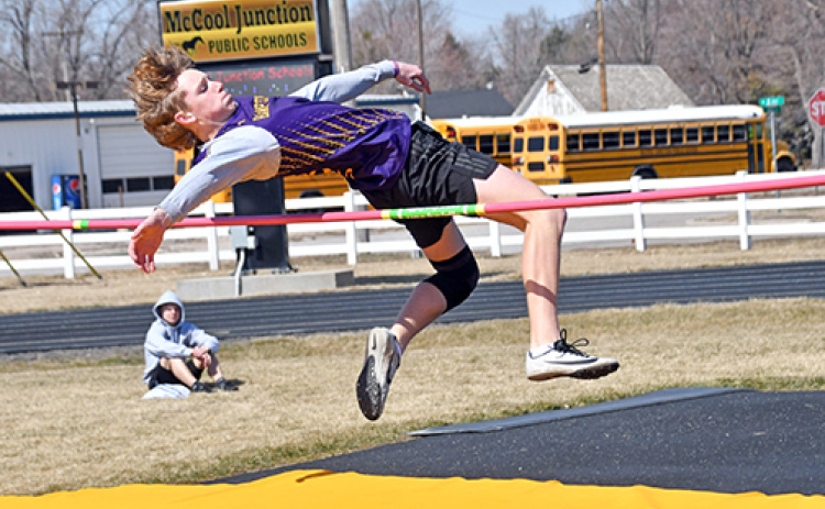 Hampton’s Brayden Dose twists his way over the bar in the high jump event at McCool Junction last week. Dose finished third in the event at 5-6.