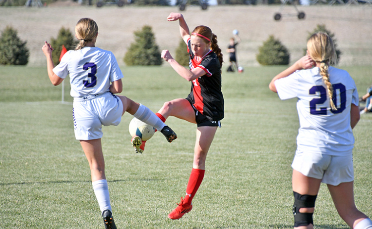 Aurora’s Hannah Janda wins a ball on the offensive end during the Lady Huskies’ 4-0 win over Holdrege Thursday.