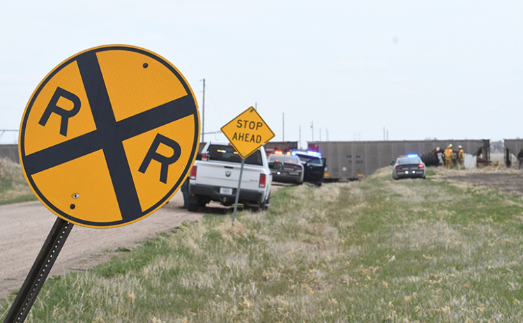The Hamilton County Sheriff’s Department, Nebraska State Patrol and Phillips Fire and Rescue personnel are shown at the scene near a railroad crossing where a tractor collided with a train on Thursday afternoon.