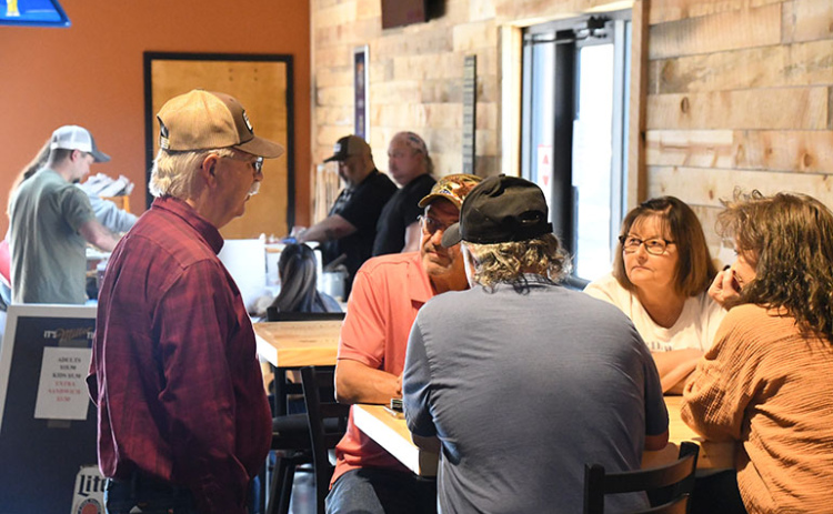 Customers enjoy the food and fellowship at the new Winchesters Saloon in Phillips.