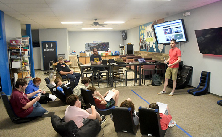 Volunteers teach a class of students at the Hamilton County Youth Center about videography via the Videography Club course in partnership with Beyond School Bells.