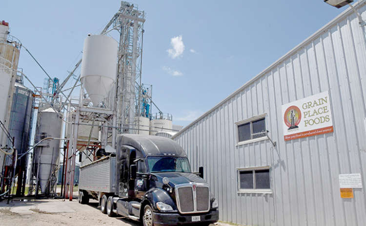 A truck unloads organic grain at the Grain Place Foods elevator. Tours of the farm and processing facilities will be included as part of the 30th annual Field Day scheduled for Saturday, July 15.