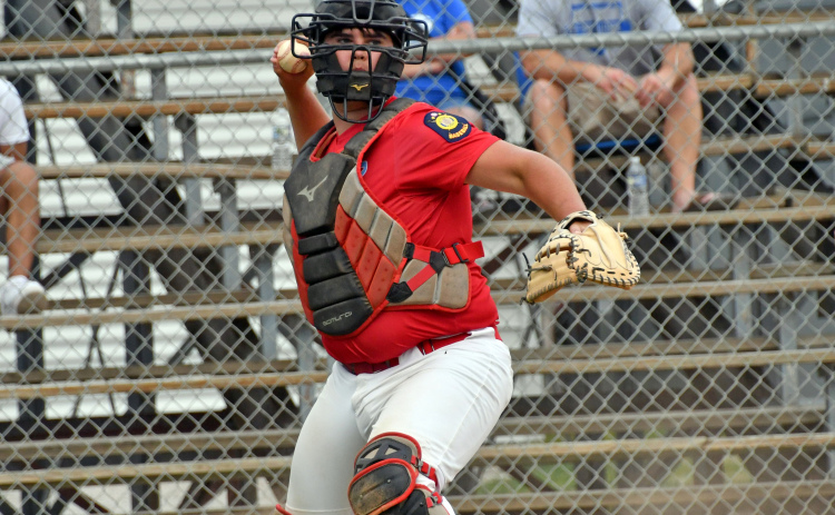 Dylan Dubas, shown here catching a game earlier this season, notched six RBIs, including a grand slam, in Aurora’s 12-3 win at Wood River Thursday.