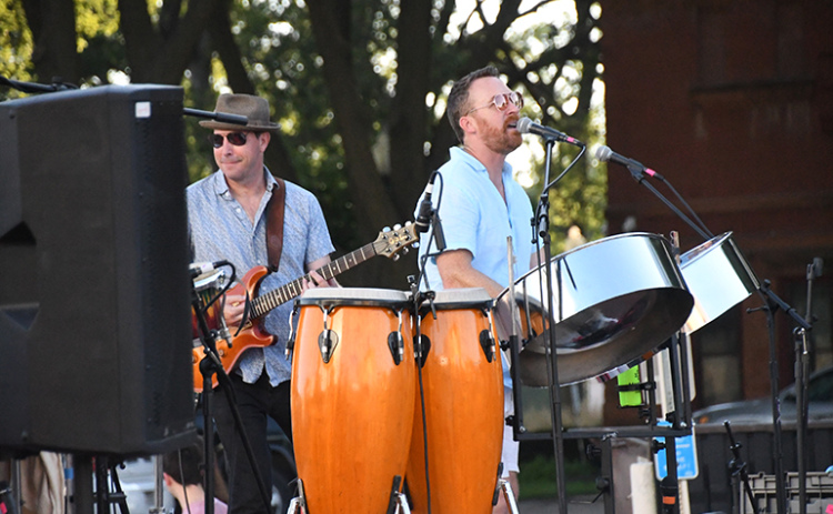 From left, Soca Jukebox band members Jason Riley and Clay Johnston perform classic hits that connected with an audience of all ages.
