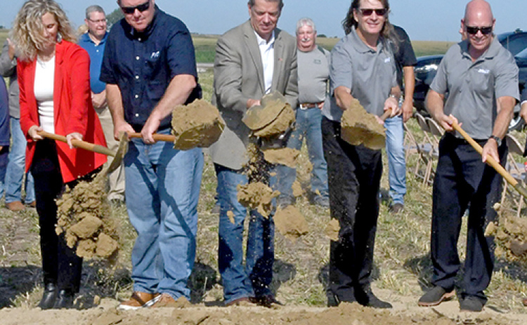 Nebraska Gov. Jim Pillen, center, demonstrates that he still knows how to handle a shovel at the Mission Critical groundbreaking Aug. 11 in Aurora. Pillen told the crowd at the ceremony Nebraska agriculture has a bright future.