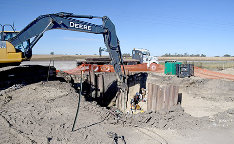 Construction crews bore a hole under the highway in order to connect the water and sewer infrastructure at Mission Critical to the city’s existing pipelines buried on the west side of the road.