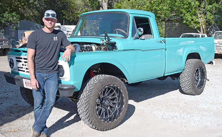 Dalton Hettle poses with his Caribbean turqoise 1964 pickup, a vehicle he has basically rebuilt from the ground up.