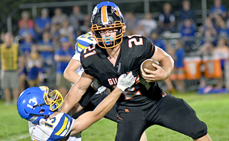 Jayden Smith (21) was a downhill runner for the Hornets all night long, totaling 119 yards on 20 carries and a touchdown. Smith is shown here during a fourth quarter run stiff arming a defender.