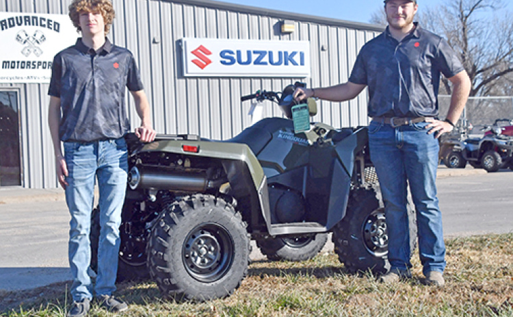Caden (left) and Karson Meyer show off one of the many new Suzuki ATV products available at Advanced Motorsports, now located at the Highway 34/14 intersection in Aurora.