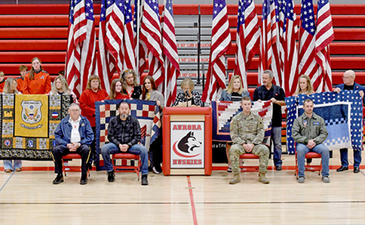 Four Hamilton County veterans await their award of Quilts of Valor at the Aurora High School Veterans Day program on Friday.