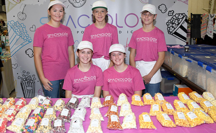 “Snackologists” at the new gourmet popcorn and ice cream business in Aurora include, front from left: Jasmine Hansen and Allison Bangs. Back from left: Kennedy Kleinschmidt, Chase Dimmitt and Isaiah Uhrmacher.