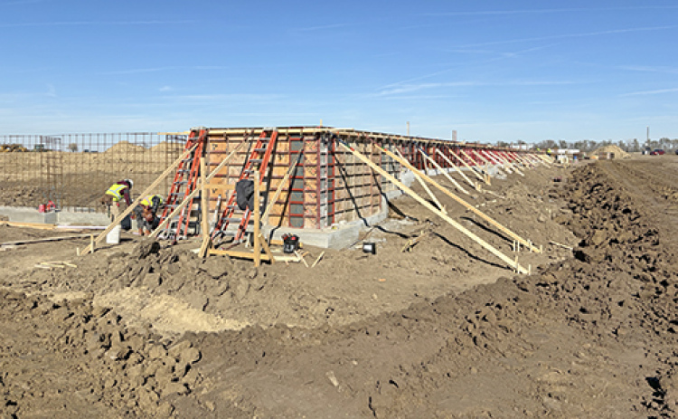 Dirt work on the Specialty Ag Formulations facility began several weeks ago at the Mission Critical site, though the project started to go vertical this week as crews laid the foundation and began working on the walls.