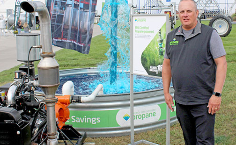 Mike Newland, who serves as the director of agriculture business development for the Propane Education and Research Council, stands next to the council’s display at Husker Harvest Days.