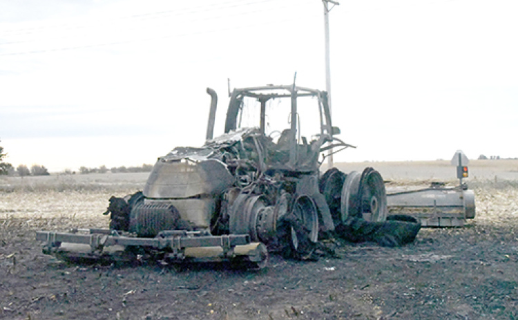 These are the charred remains of a Case tractor that was destroyed by fire Thursday on a field northeast of Aurora.
