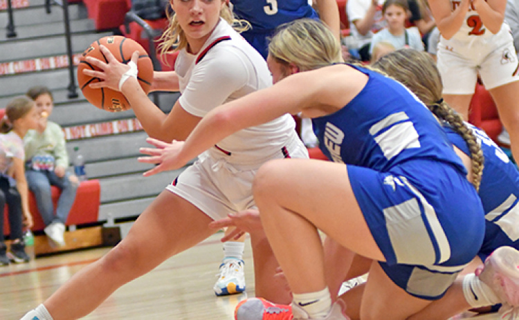 Denae Nachtigal scraps for an extra offensive possession during Aurora’s 32-26 victory over Lakeview Friday. Nachtigal tallied 17 points in the win.