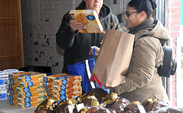 Darrell Schmidt was one of many volunteers helping with this year’s Hamilton County Food Pantry holiday distribution.