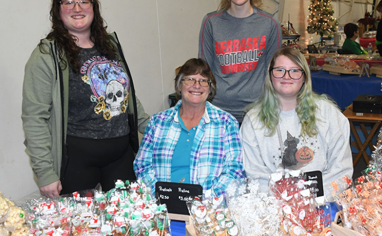 Sandy’s Cookies, Macs & More offered a variety of treats at the Holiday Shopping Spectacular at the Hamilton County Fairgrounds on Nov. 4. Overseeing the operation is Sandy Sebesta, seated center, along with granddaughters, from left, Autumn Paquin, Nadine Lovejoy and Brooklyn Paquin.