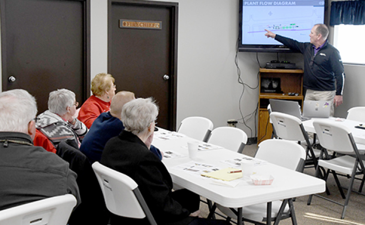 Dale Broekmeier, right, points to a plant flow diagram of the new CVA white corn cleaning plant currently under construction in Hampton. The presentation was part of the program at last Tuesday’s second Community Conversations with Coffee event sponsored by Hampton Public Schools and held at the Fire Barn.