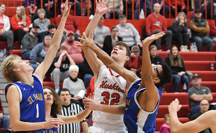 Ethan Ramaekers goes up strong for a shot inside during Aurora’s 60-28 win over St. Paul Thursday. Ramaekers paced the Huskies with 16 points in the game.