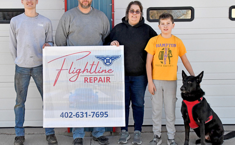 From left, Tyson Kottwitz, Leland, Angie and Reis Stump alongside their dog shadow.