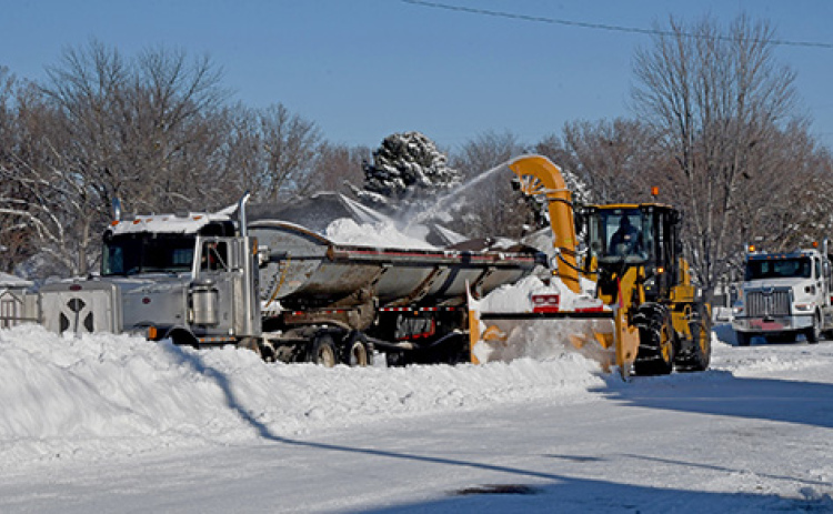 City crews remove snow in downtown Aurora.