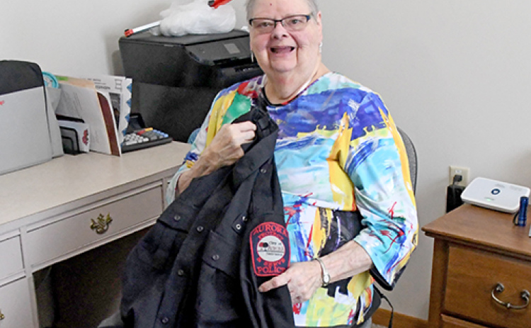 Now living at East Park Villa, former senior center director Barbara Graham now helps the Aurora Police Department by sewing on police patches and repairing uniforms.