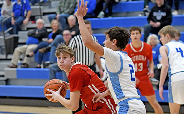 Aurora senior Graham Christenson gets poised to put up a shot during Aurora’s holiday tournament loss to Ashland-Greenwood.