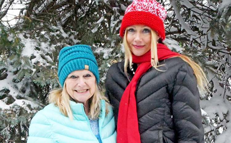 Documentary film producer Jennifer Jarosik, right, from Dubai takes time for a picture with her mother, Connie Bunker of Aurora.