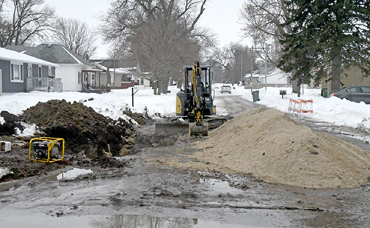 This was the scene at 2nd and G Streets in Hampton last Tuesday afternoon after workers repaired a water main break at that intersection. Village water users have been under a boil order for a week since the entire water system had to be shut down to make the repair.