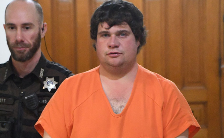 Murder suspect Caleb Arnett arrives for his arraignment hearing on Dec. 5