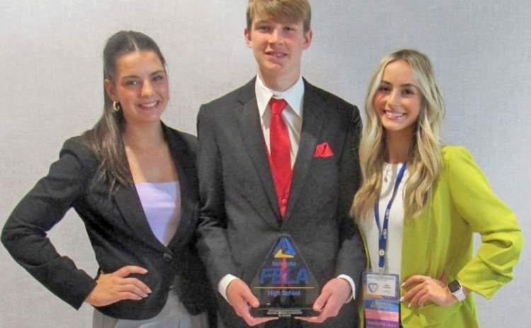 Nebraska FBLA President Graham Christenson (center) teamed with former Aurora FBLA secretary, Aleah Vinkenburg (left) and former chapter president, Kylie Svoboda, placed ninth in social media strategies at the National Leadership Conference of FBLA last July.