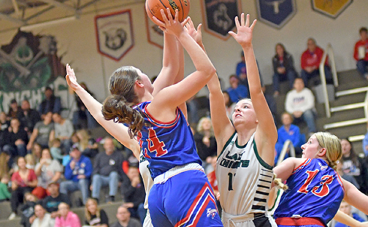 High Plains junior Rylee Ackerson finds a bit of space in the lane during the Storm’s first-ever district final Friday. This year’s HPC girls set several records, including season wins (16).