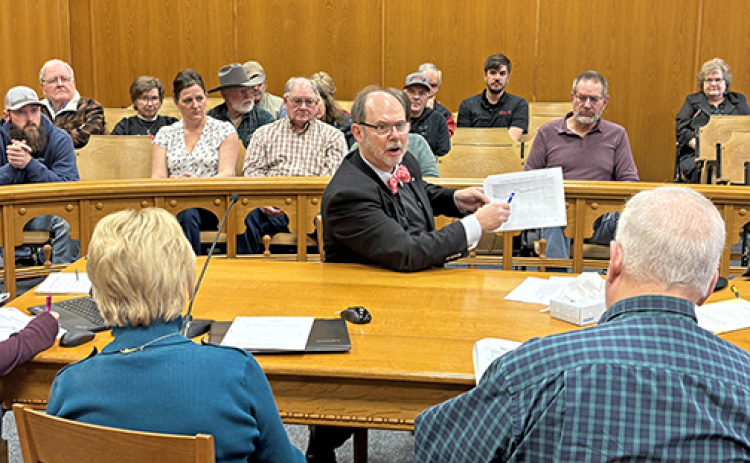 Doug Frank, center, shares information with county board members Rich Nelson, right, and Nancy Salmon during Monday’s presentation at the Hamilton County Courthouse. More than 25 people attended the meeting, showing shared concern with the integrity of local elections.