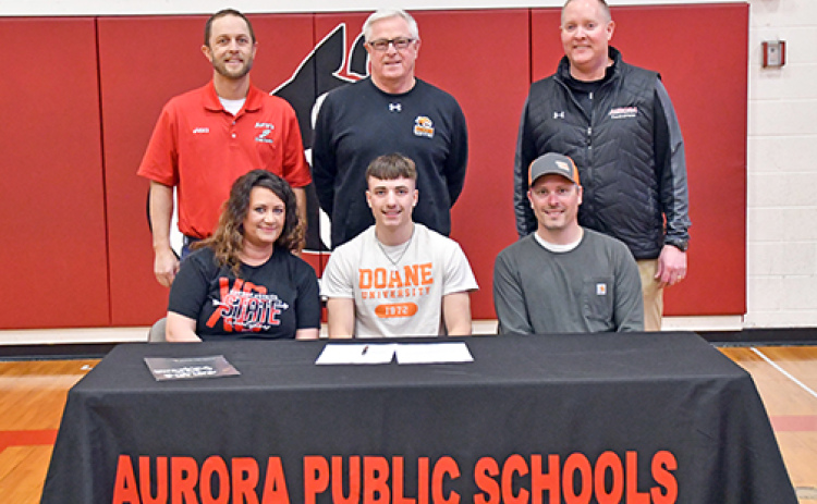 Lucas Gautier signed a letter of intent to run track and field at Doane University March 5 alongside his parents, Jessica Gautier and Chad Salmon, Aurora cross country coach Tony Sigler, Doane track coach Ed Fye and Aurora track coach Gordon Wilson.