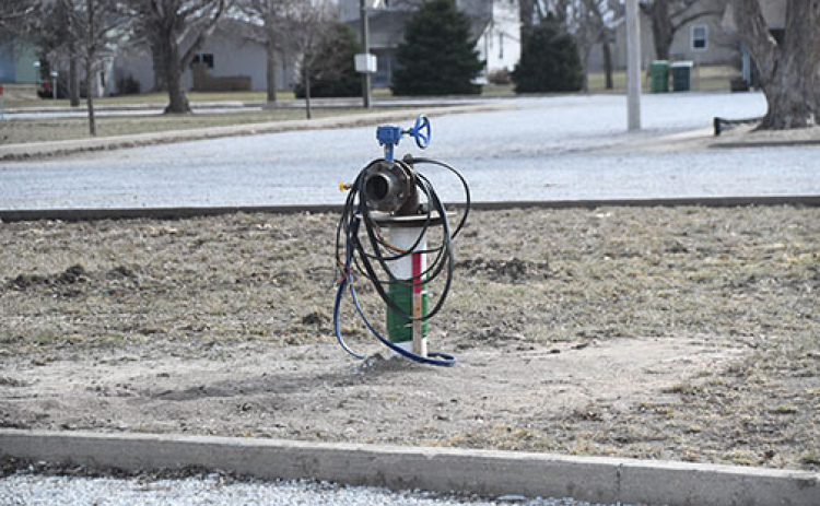 The well head for the Village of Hampton’s newly dug test well sits in a grassy area between the parking lots at the ball park on the west side of town. Water from the well tested at over 15 for nitrates so it cannot be used for drinking water.