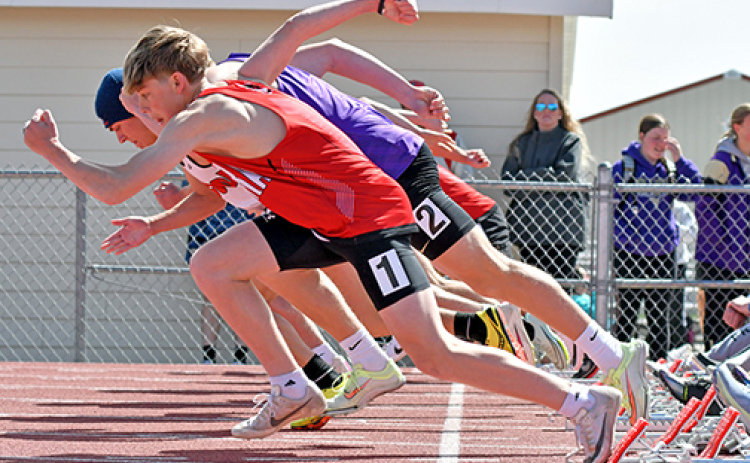 Aurora’s Isaiah Uhrmacher explodes out of the blocks from lane one during one of several 100 meter dash preliminaries at Thursday’s Gothenburg Dutch Zorn Invite.