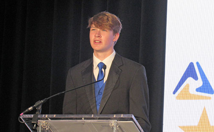 Aurora senior Graham Christenson addresses a large crowd during the state FBLA conference in Kearney.